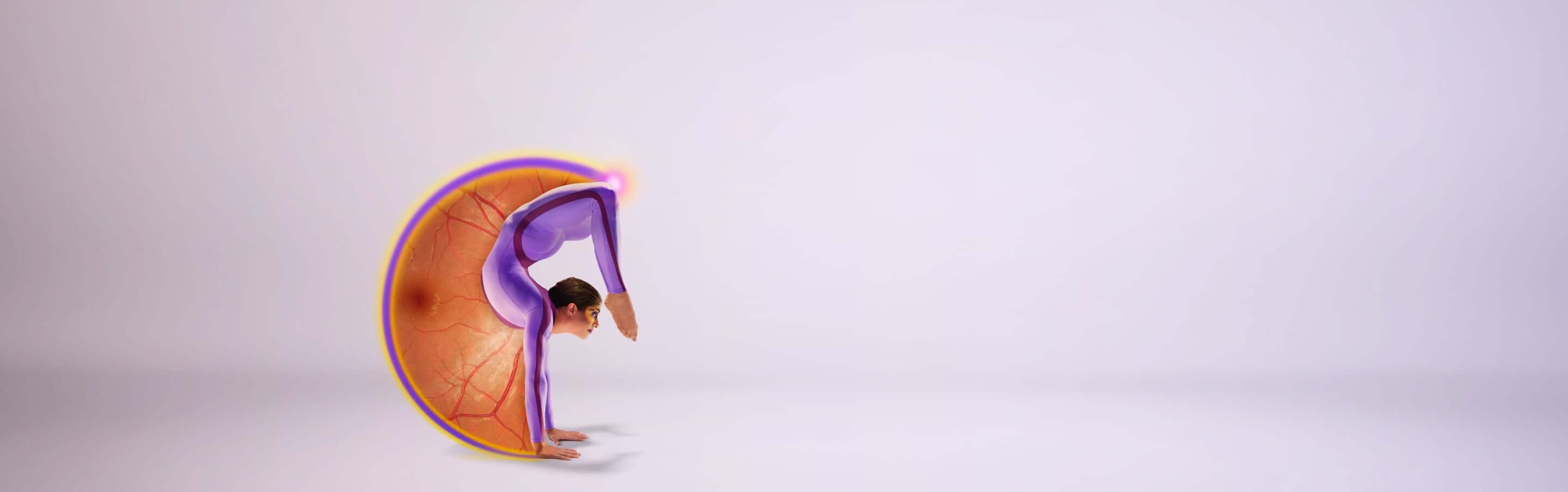 A talented contortionist doing a handstand has curved her back to bring her toes down in front of her eyes, forming a G shape with her body. The movement created a semicircle which is filled with an image of the back of an eye. The edge of the circle glows.